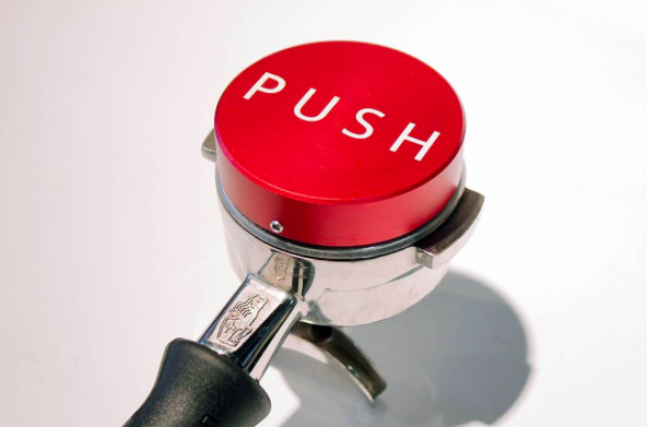 Clockwork Espresso red PUSH Coffee tamper in basket